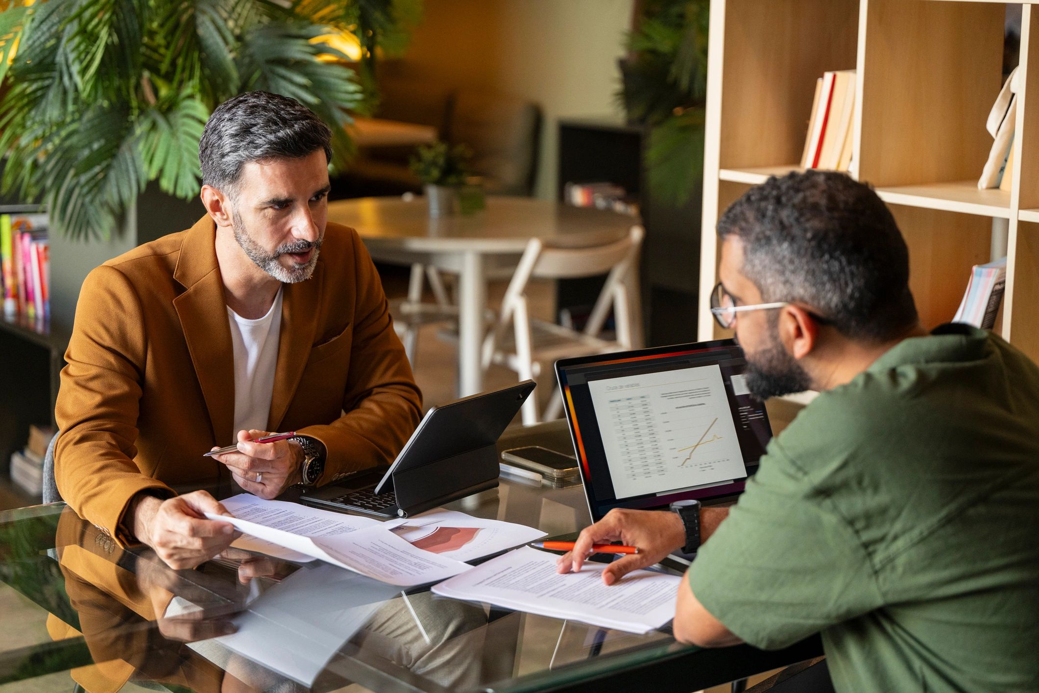 Two professionals meeting to discuss real estate investment planning