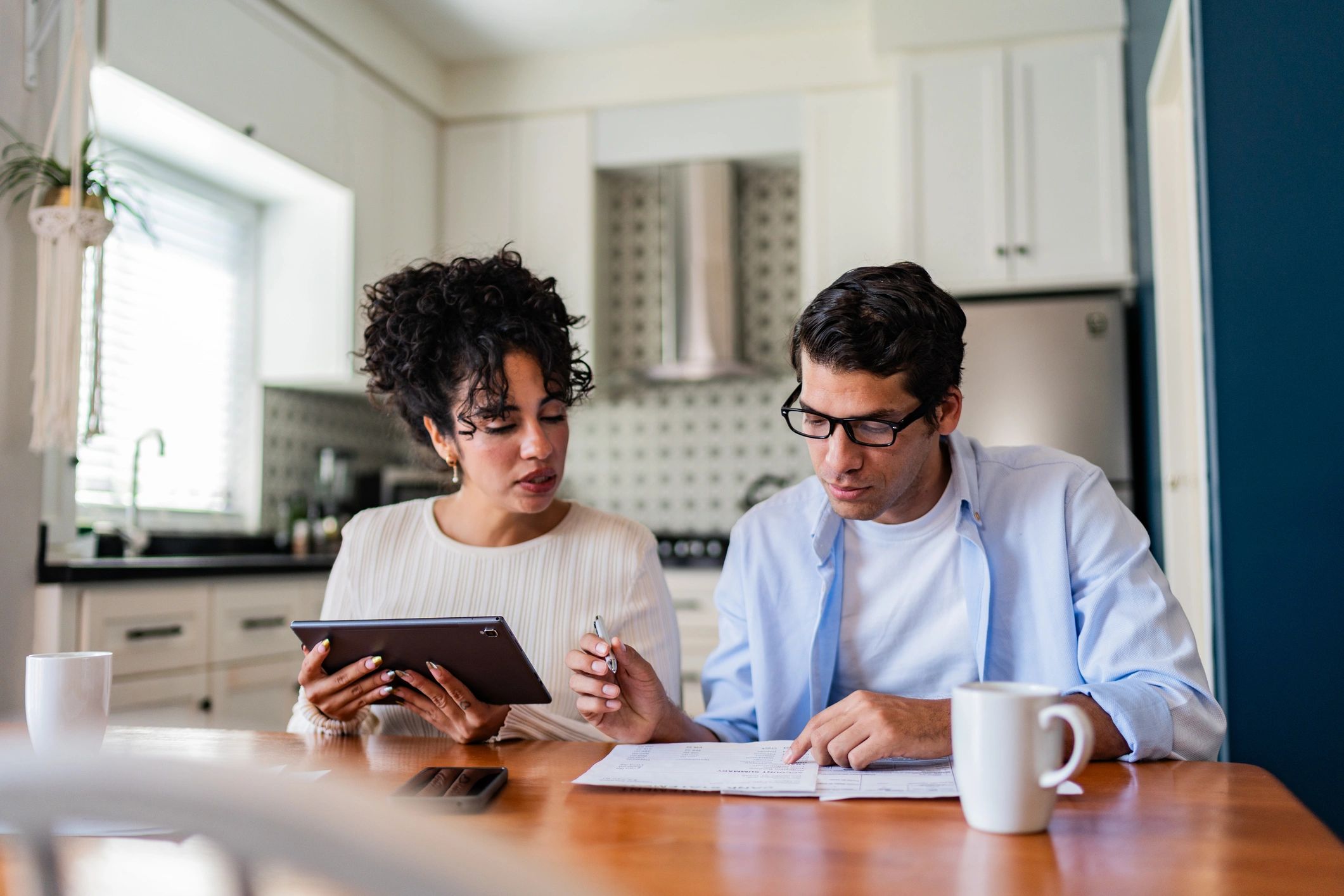 Couple reviewing finances and plans at home